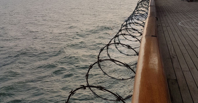 You are currently viewing Blackout on Black Watch: Pirates, Razor Wire and Water Cannons